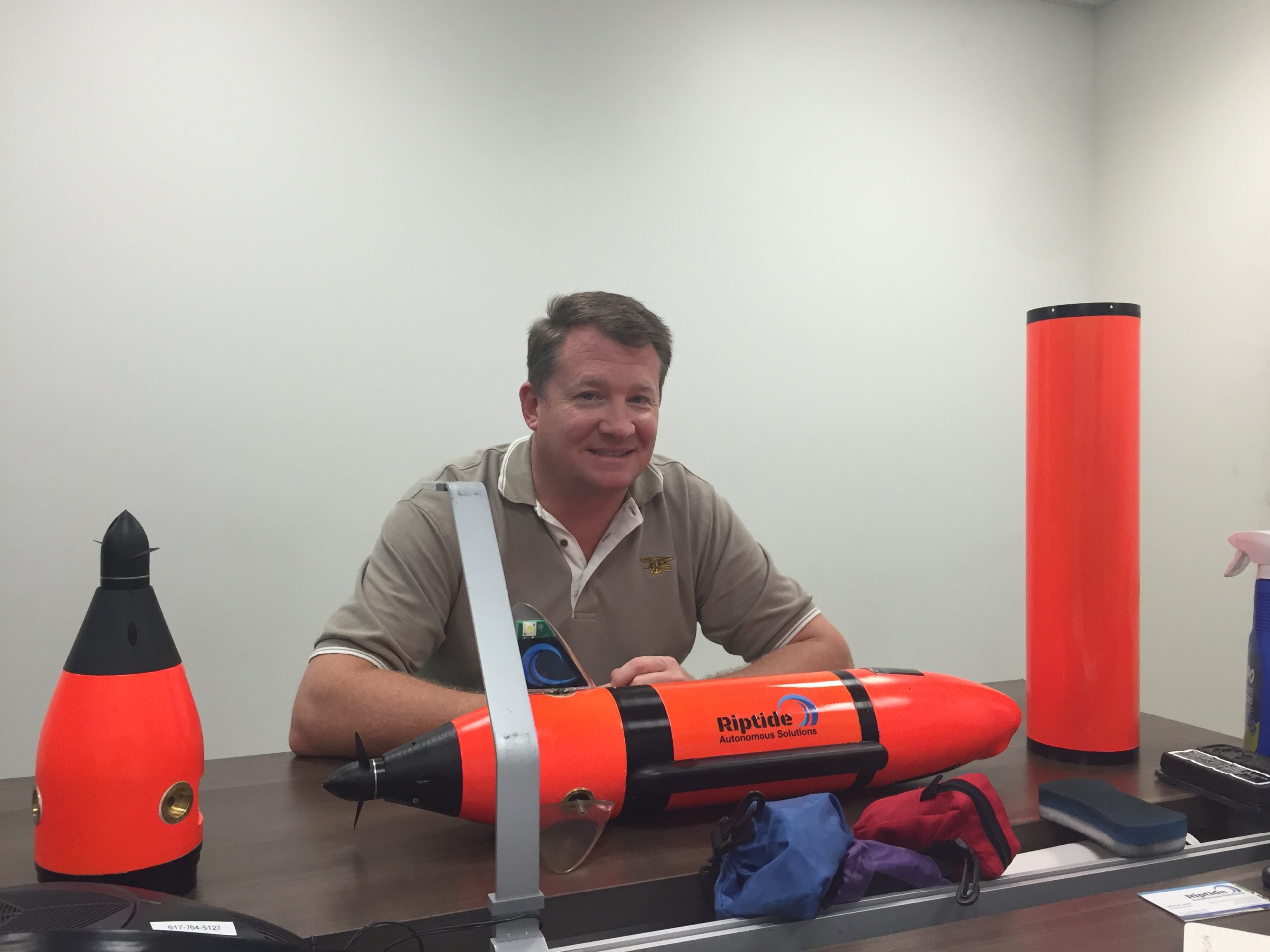 President and CEO Jeff Smith, Riptide Autonomous Solutions, displays one of their Micro-UUVs